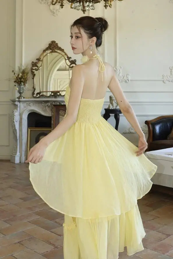 yellow dress fairy Fantasy Woman Blonde Forest Fairy. Fashion Model in a Long Yellow Dress with Butterfly Wings Holds in Hand and Smell Stock Photo